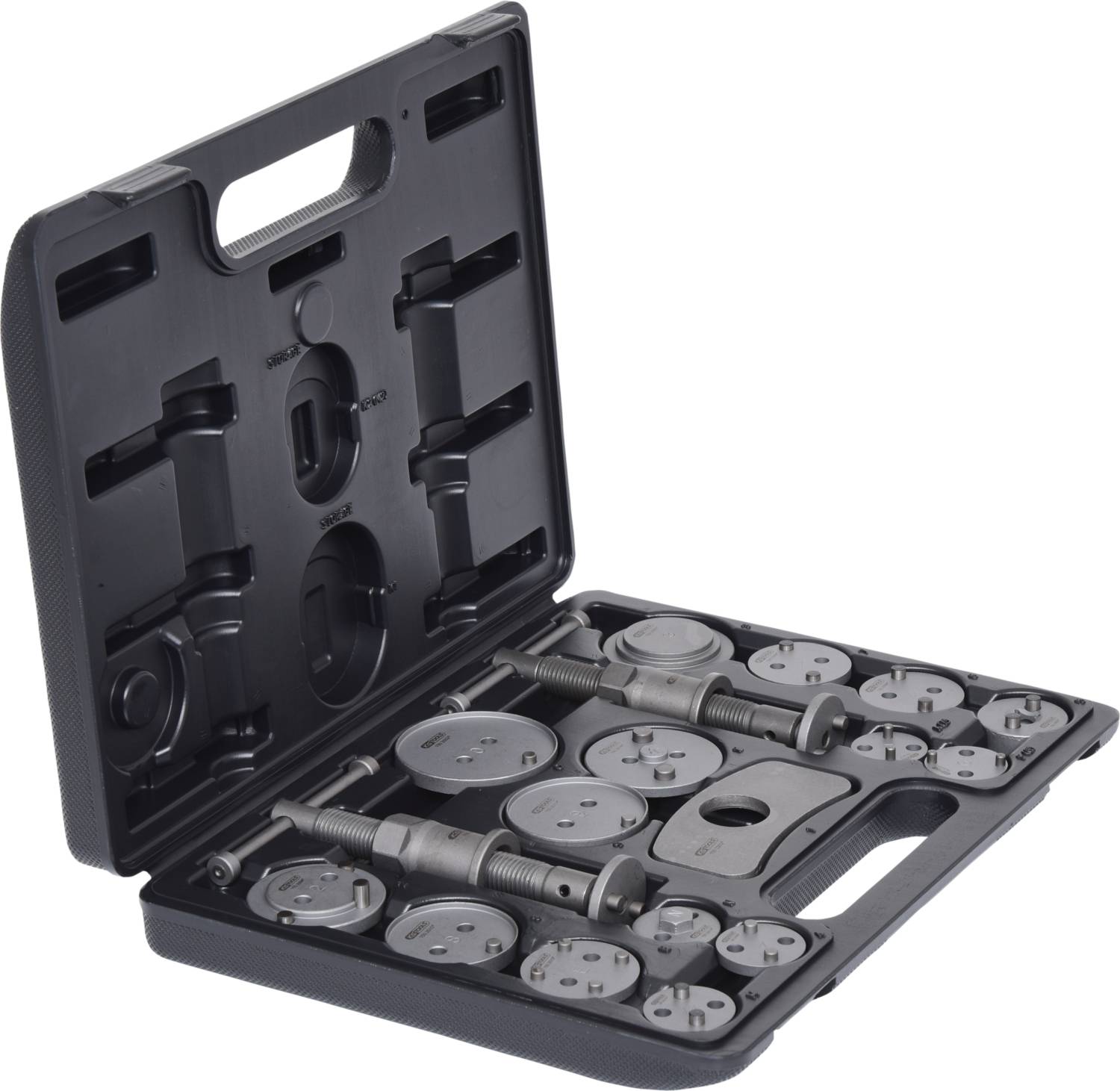 Otwarty kufer z narzędziami, w którym znajdują się precyzyjnie ułożone przyrządy do wciskania tłoczków hamulcowych o różnych rozmiarach i kształtach.