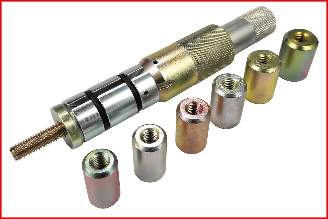 Metalowe narzędzie z wieloma wymiennymi końcówkami ułożonymi obok siebie. Idealne do procesów obróbczych.