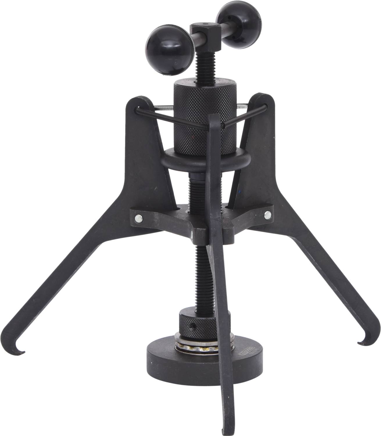 Czarne, solidne urządzenie na trzech nogach z mechanizmem obrotowym, prawdopodobnie ściągacz lub narzędzie zaciskowe używane w warsztatach.