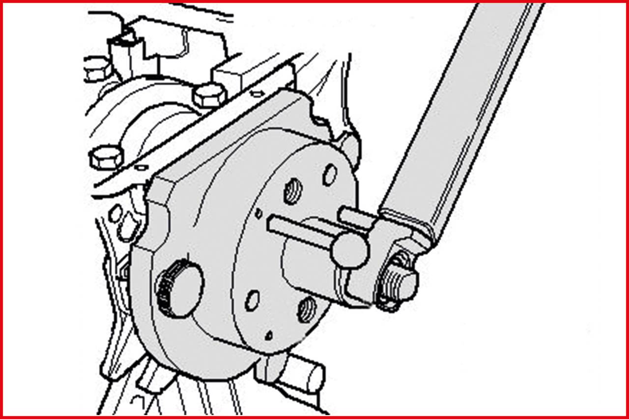 Rysunek techniczny maszyny z kluczem hydraulicznym pracującym przy śrubie. Widoczne szczegóły mechaniczne.