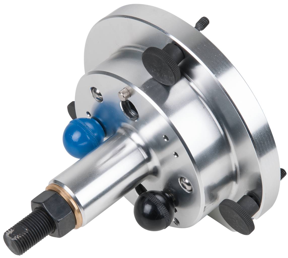 Srebrna, cylindryczna metalowa część z kilkoma śrubami i niebieskim przyciskiem, prawdopodobnie złączka lub element sprzęgła maszynowego.