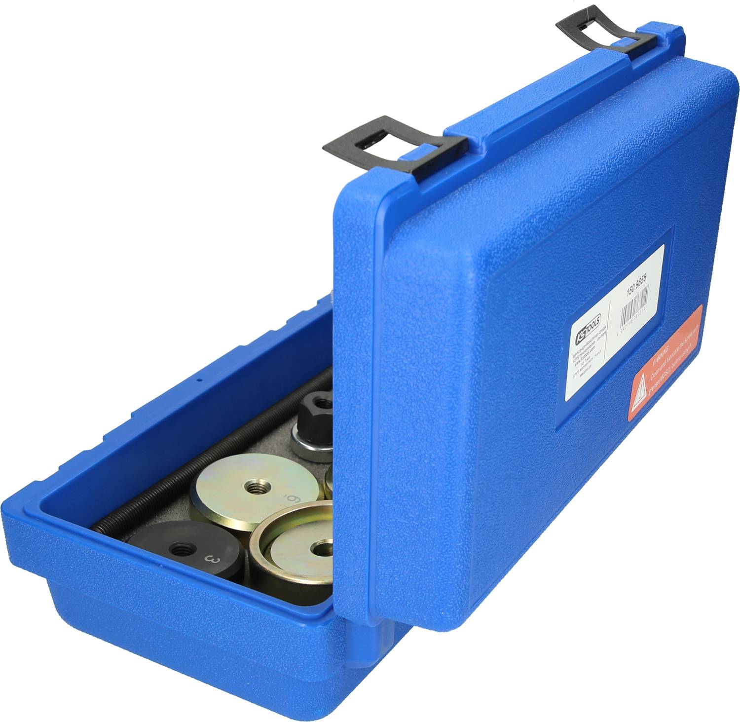 Niebieski kufer z otwartą pokrywą, w środku widoczne są metalowe odważniki o różnych rozmiarach. Etykieta ze specyfikacjami jest dobrze widoczna.