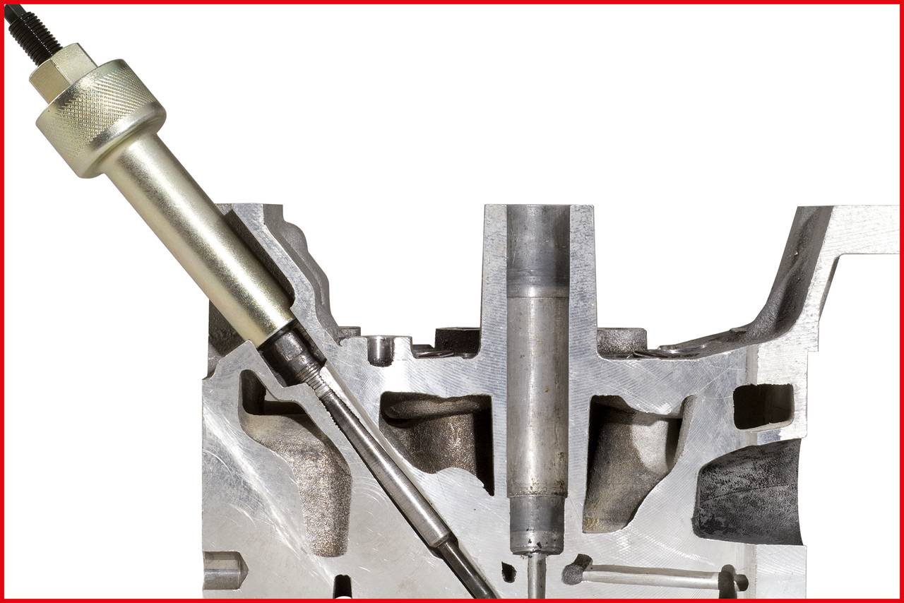 Przekrój poprzeczny elementu metalowego z wbudowanym narzędziem lub czujnikiem, otoczony komponentami mechanicznymi.