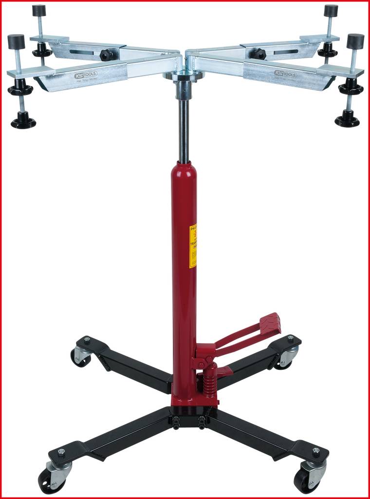 Czerwony, regulowany wysokościowo podnośnik skrzyni biegów z czterema rolkami. Górna część wyposażona jest w ramiona stabilizujące. Odpowiedni do prac warsztatowych.