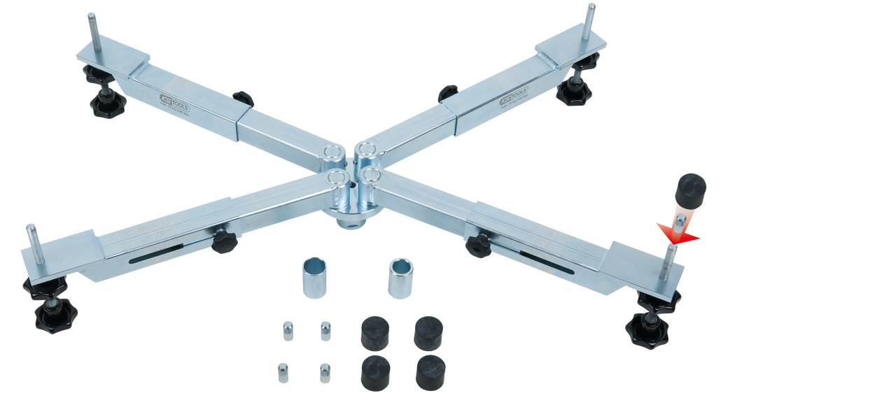 Regulowany krzyż metalowy o czterech ramionach, z zamocowanymi stopkami na końcach. W zestawie dwie dodatkowe nakrętki do montażu.