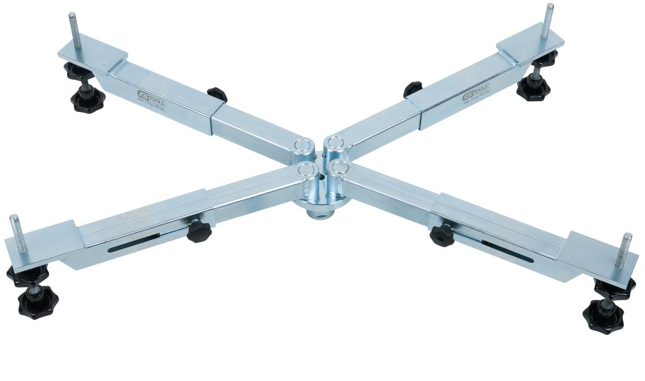 Regulowana metalowa rama z czterema przedłużanymi ramionami i kółkami, odpowiednia do transportu dużych urządzeń gospodarstwa domowego.