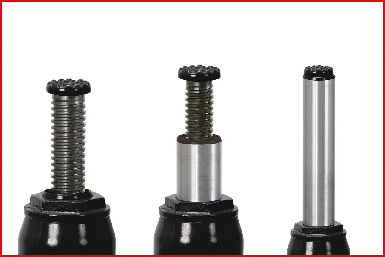 Trzy amortyzowane elementy ciśnieniowe w różnych pozycjach; po lewej i pośrodku z częściowo wysuniętą sprężyną, po prawej całkowicie rozłożone.