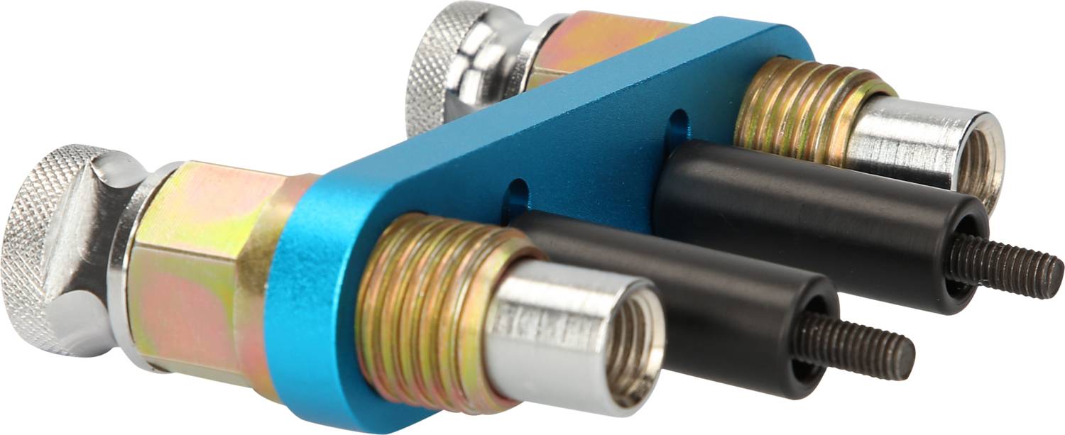 Dwa kolorowe złącza gazowe wykonane z metalu i tworzywa sztucznego z niebieskimi i złotymi elementami, zamontowane na niebieskiej płytce metalowej.