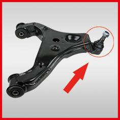 Czarny wahacz ze strzałką i czerwonym kółkiem wskazującym na specjalną część zawieszenia.