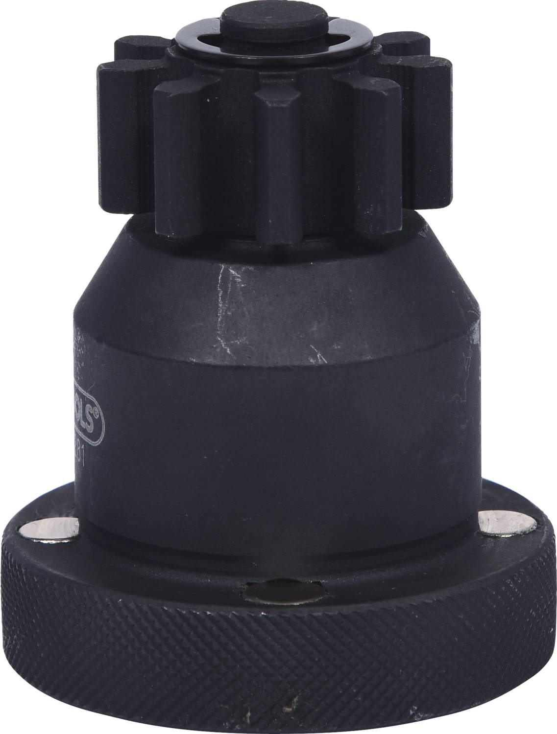 Czarny element mechaniczny w kształcie cylindra z uzębieniem na górnej powierzchni, prawdopodobnie stanowiący część większego systemu technicznego.