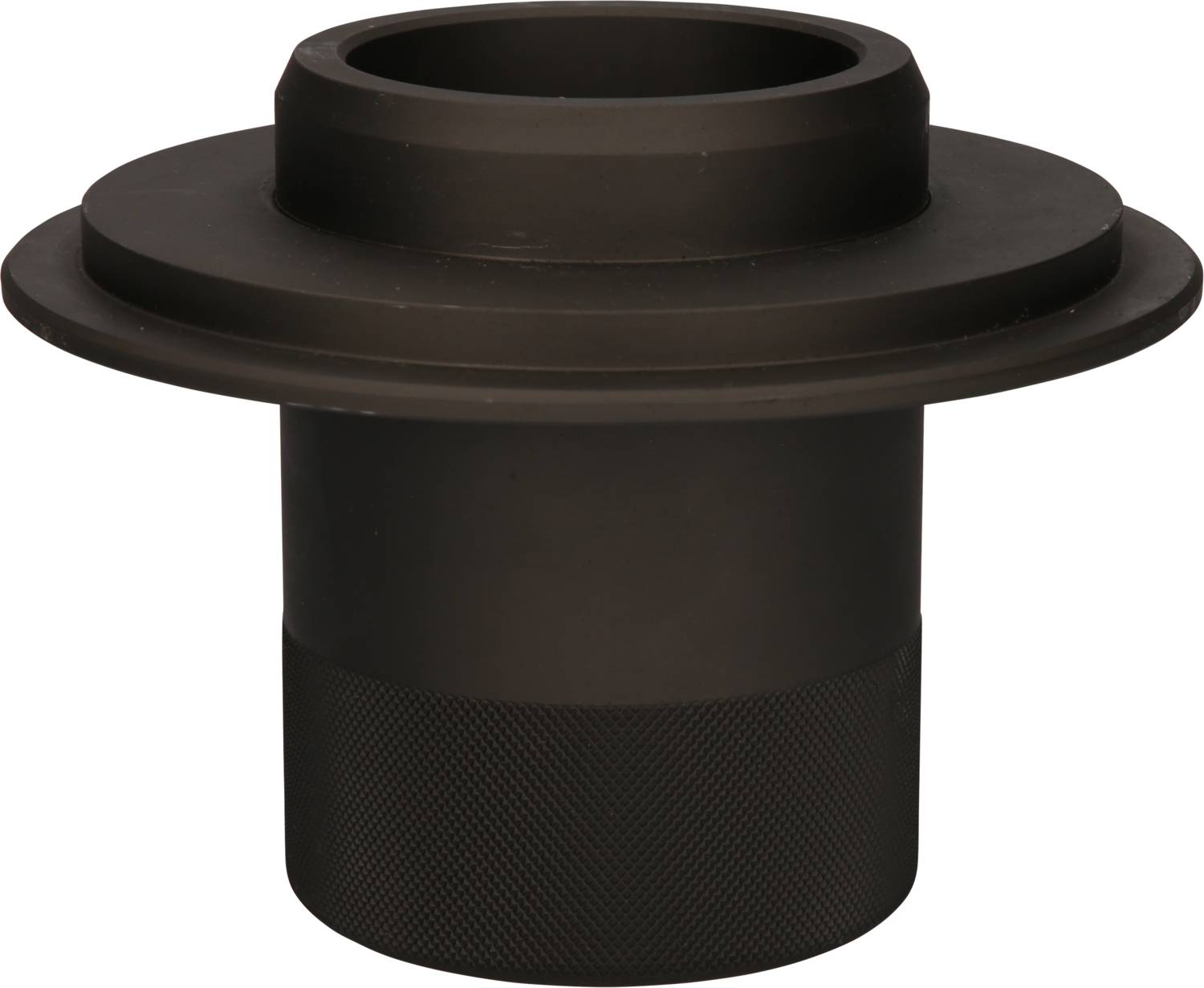 Czarny element metalowy w kształcie cylindra z szerokim kołnierzem u góry, prawdopodobnie część maszyny lub podzespół.