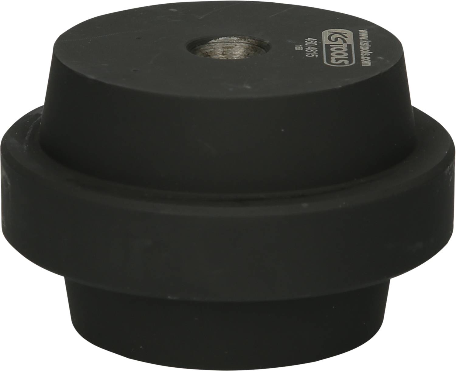 Czarny element gumowy z centralnym otworem, opisany od góry. Stosowany jako tłumik drgań w zastosowaniach technicznych.