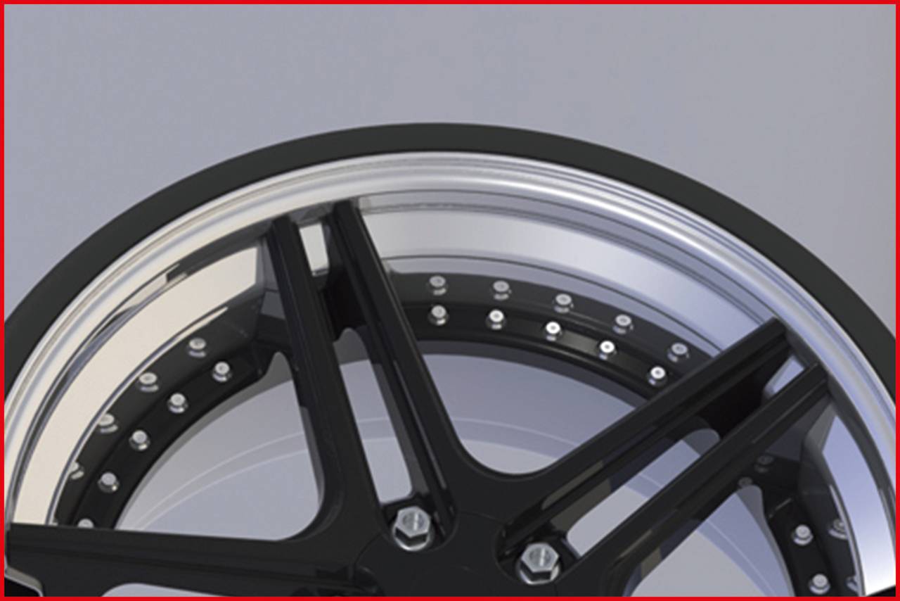 Zbliżenie czarnej krawędzi felgi z błyszczącymi śrubami na szarym tle.