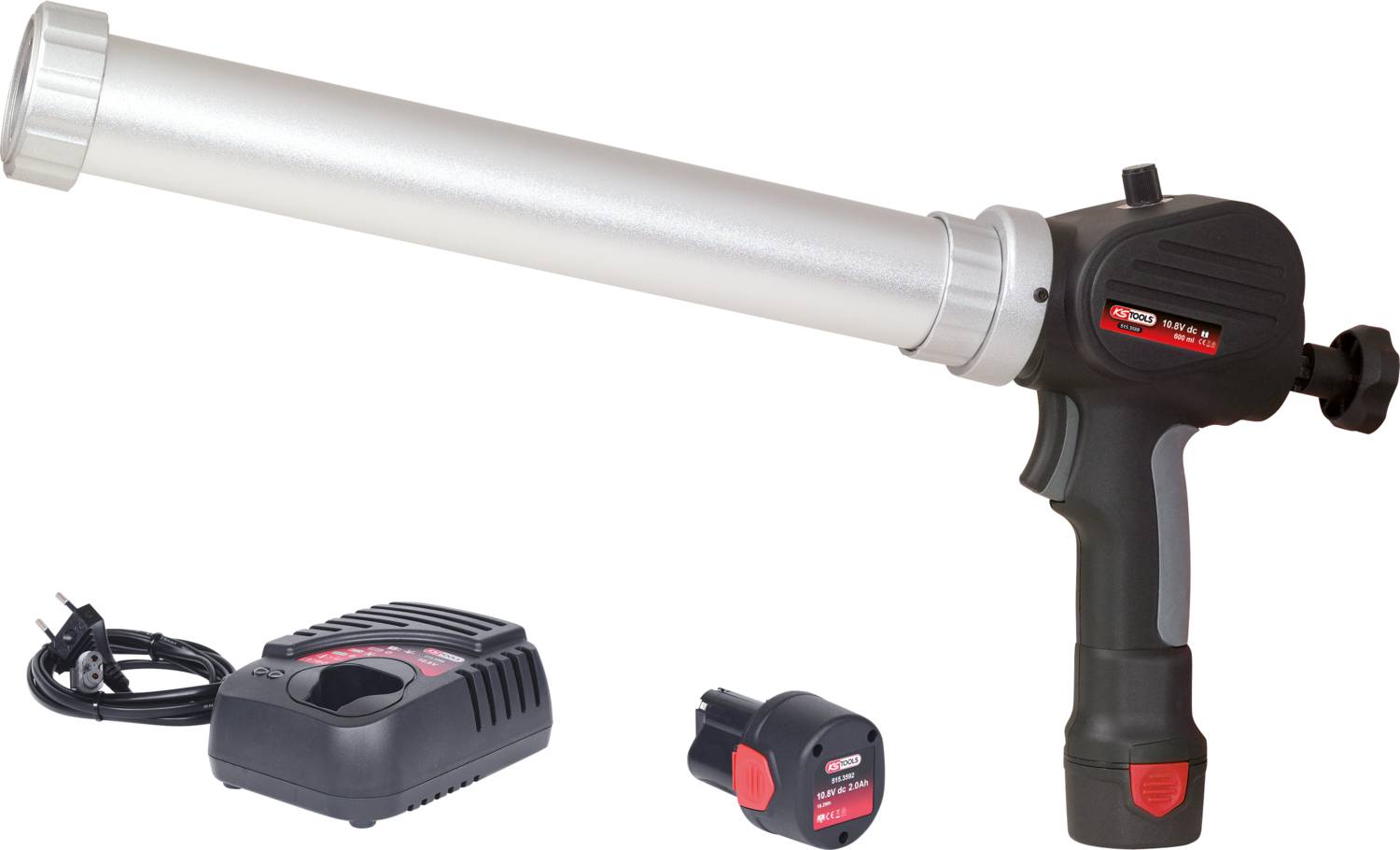 Akumulatorowy pistolet dozujący z srebrną rurką i czarną rękojeścią, obok ładowarki i akumulatora. Idealny do prac montażowych.