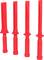 Cztery czerwone, pałkowate obiekty z tworzywa sztucznego z płaskimi końcówkami stoją obok siebie, prawdopodobnie jako sprzęt treningowy lub zabezpieczający.