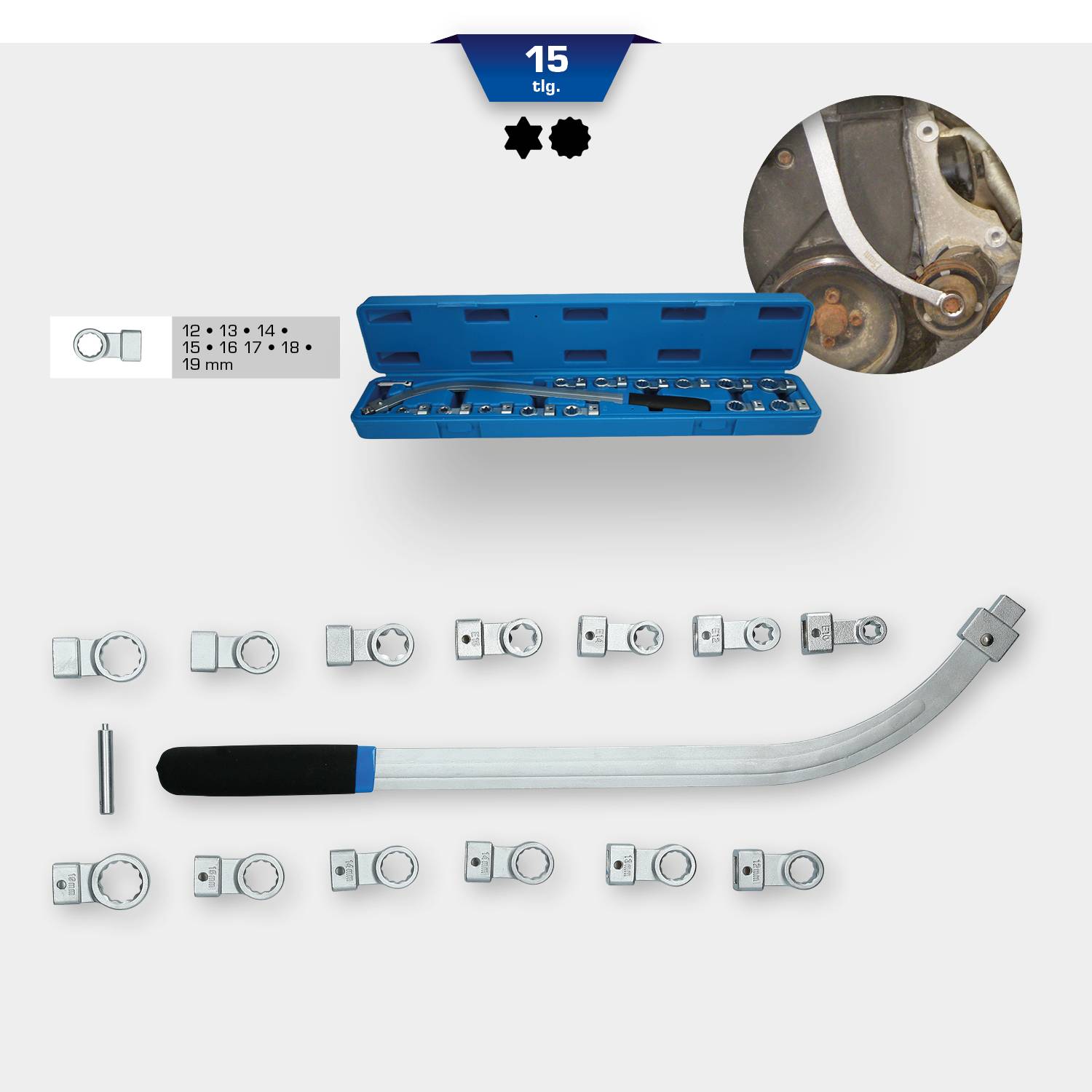 Zestaw 15 kluczy płaskich w niebieskim etui o różnych rozmiarach. Zawiera zakrzywiony pręt przedłużający oraz uchwyty.