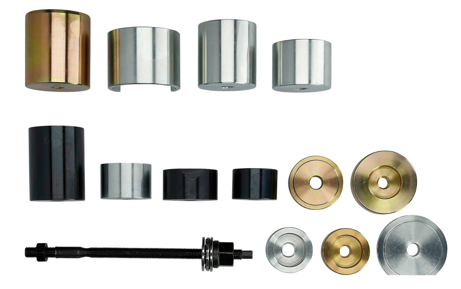 Różne rozmiary metalowych cylindrów i krążków, a także śruba z łożyskami. Prawdopodobnie komponenty do montażu maszyny.