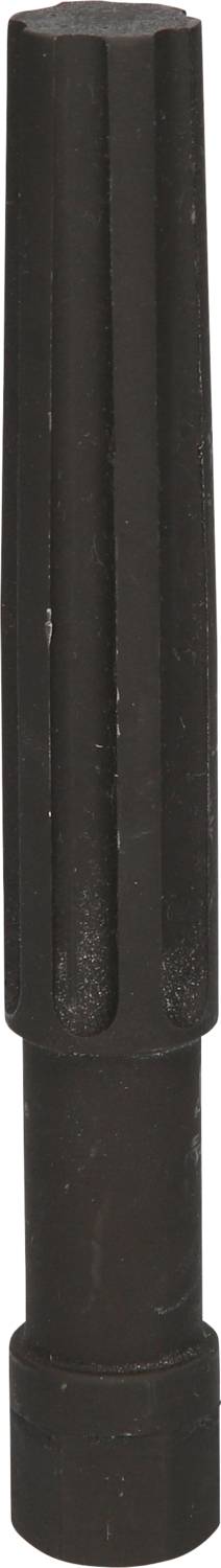 Czarny cylindryczny obiekt, prawdopodobnie element lub narzędzie, stojący pionowo.