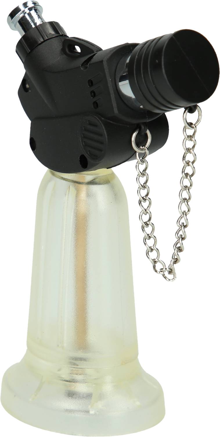 Mały, czarny palnik butanowy na przezroczystej podstawie, z osłoną ochronną przymocowaną po boku na łańcuszku.