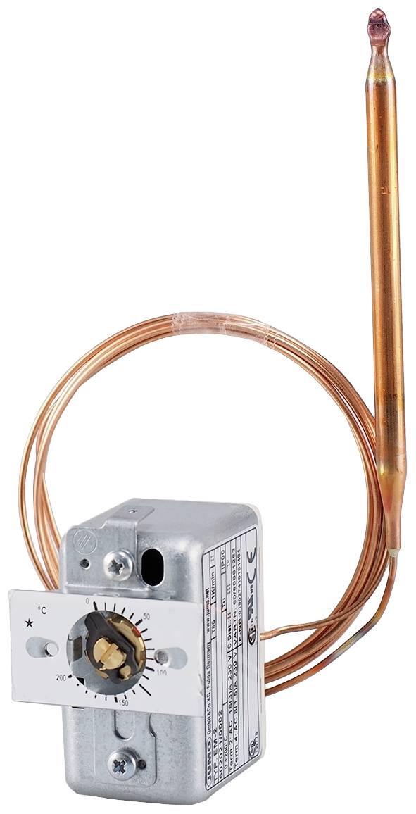 Termostat z czujnikiem miedzianym i regulatorem, zamontowany na płycie metalowej. Stosowany do regulacji temperatury w systemach grzewczych.