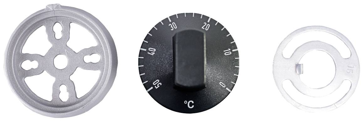 'Trzy różne elementy metalowe i z tworzyw sztucznych: okrągła tarcza z nacięciami, pokrętło z oznaczeniami temperatury oraz kolejny okrągły element z wycięciami.'