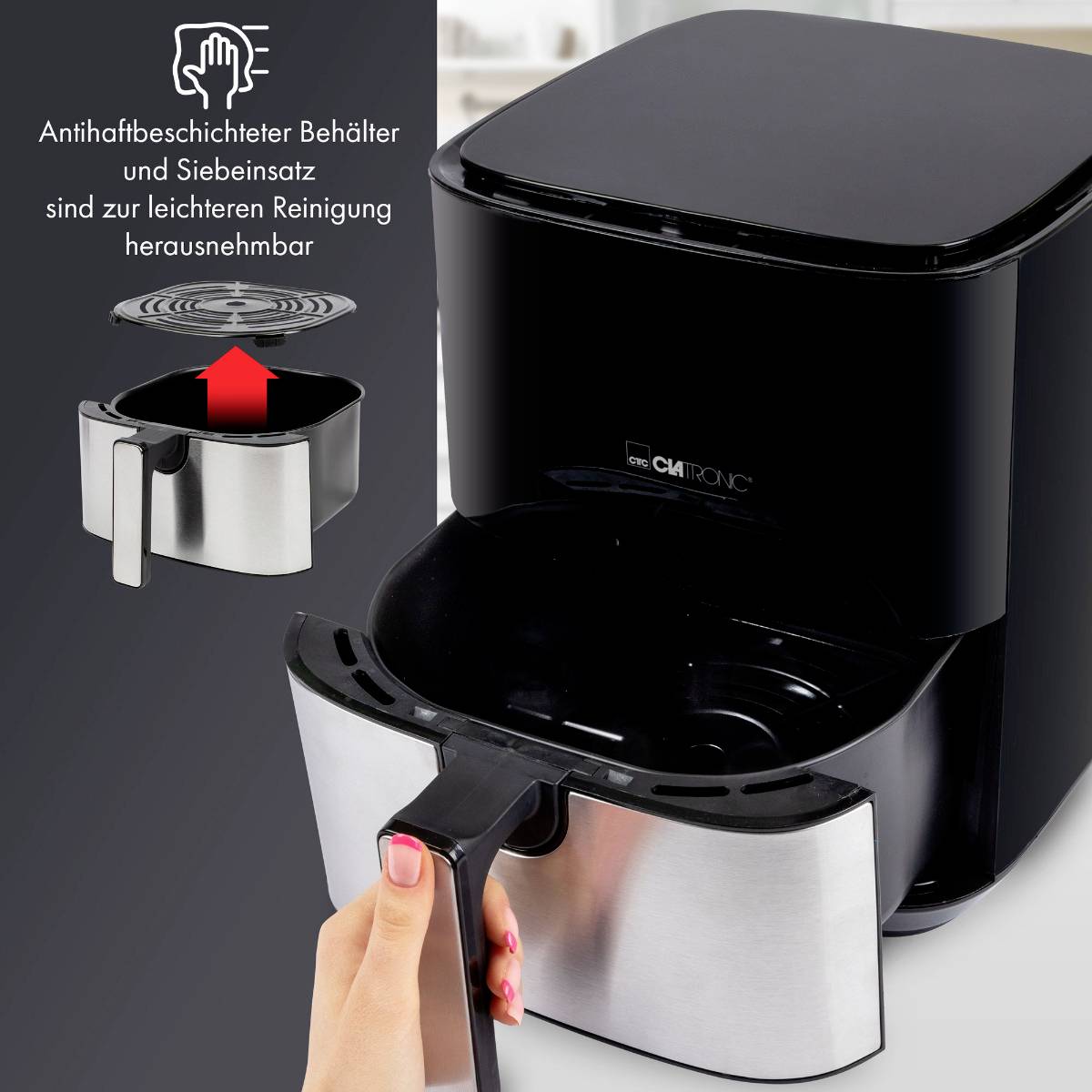 'Pojemnik powlekany powłoką przeciwprzylegającą i wkład sitowy, łatwy do wyjęcia do czyszczenia' - Obraz czarnego urządzenia z wymiennym pojemnikiem.