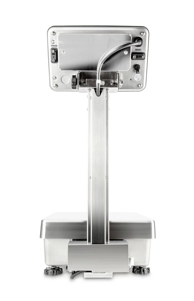 Cyfrowa waga od tyłu, pokazująca wyświetlacz i punkty przyłączeniowe. Obudowa w kolorze srebrnym z solidną podstawą. Używana do precyzyjnych pomiarów masy.