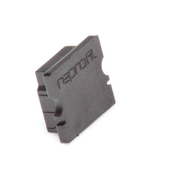 Czarny blok z tworzywa sztucznego z wygrawerowanym tekstem 'reproril'.