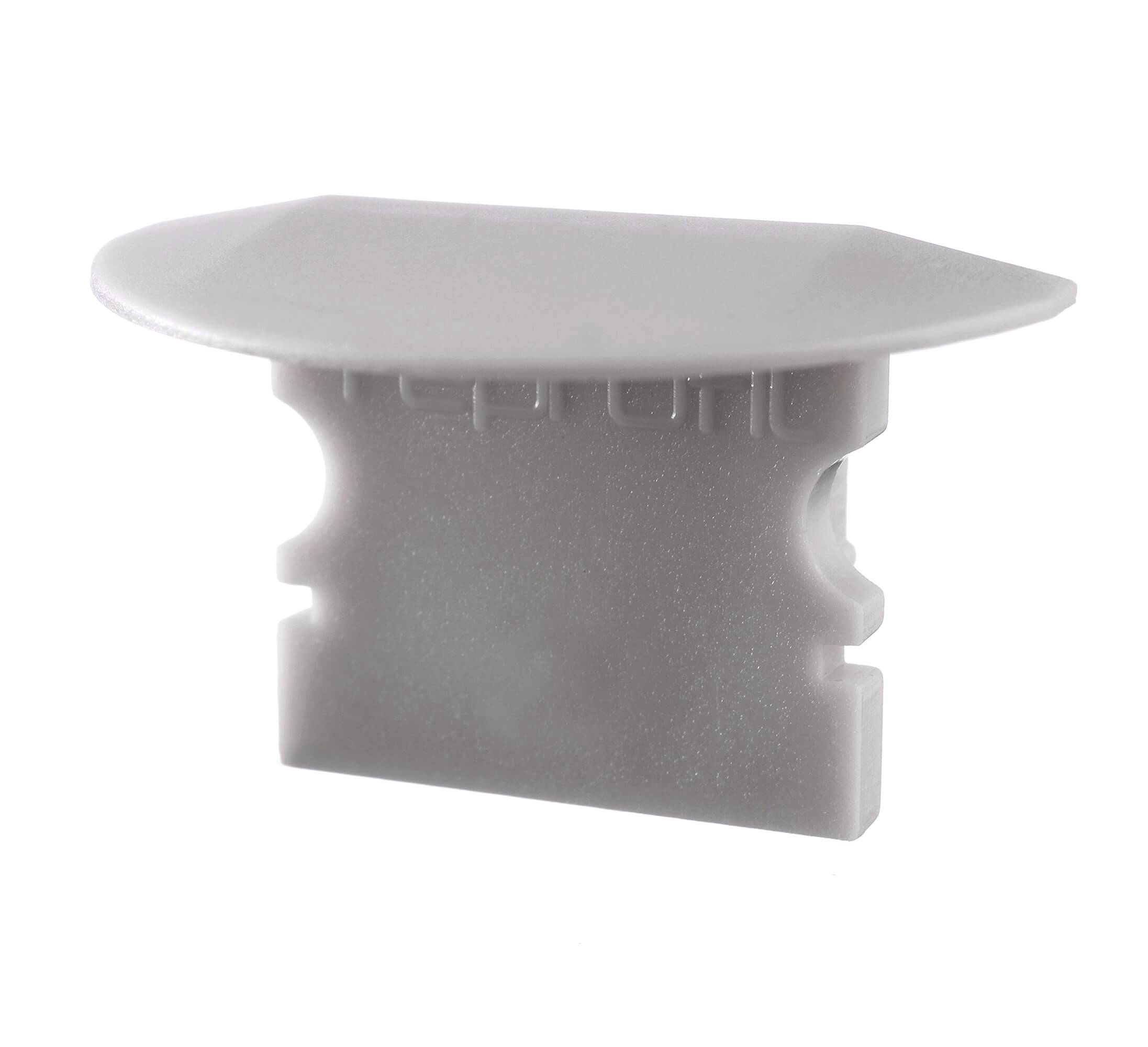 Biały, prostokątny korek plastikowy z zaokrąglonymi krawędziami, służący jako zaślepka otwartych końcówek rur lub otworów.