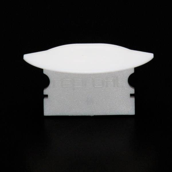 Biała żyletka na czarnym tle, częściowo zakryta białym plastrem ochronnym.