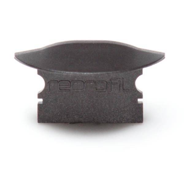 Czarna część z tworzywa sztucznego z napisem 'reprofil'. Posiada wypukłą górną powierzchnię oraz dwa wycięcia w postaci rowków po bokach.