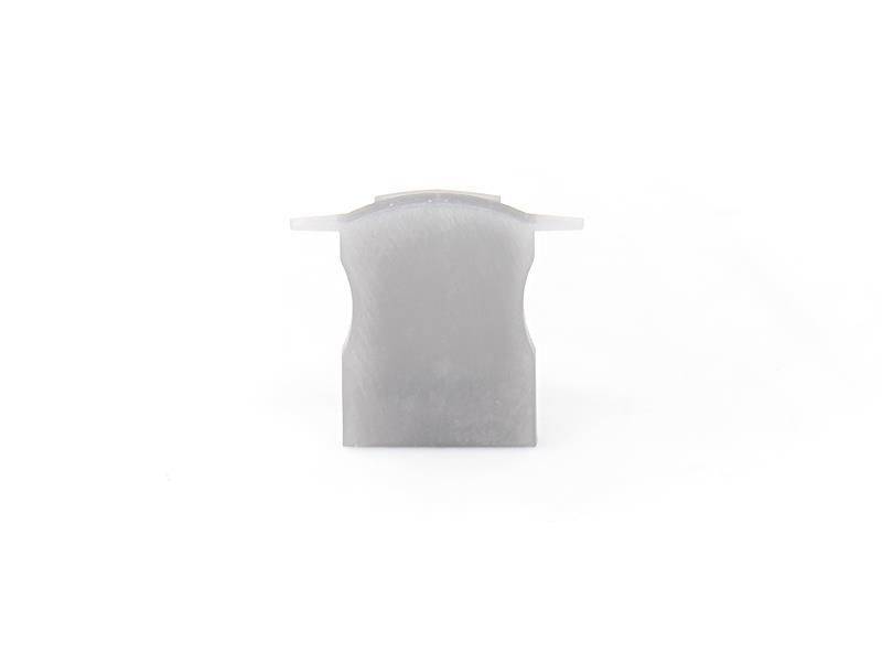 Szary, prostokątny element z tworzywa sztucznego lub moduł na białym tle.