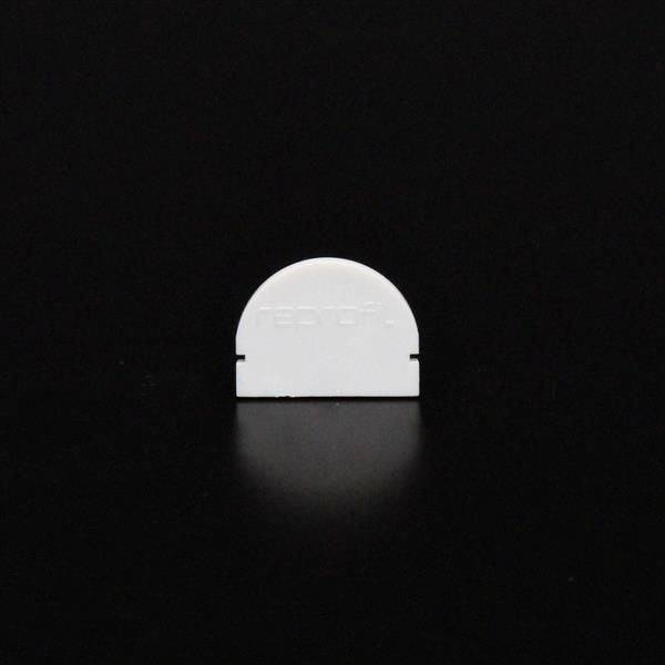 Biały, półkolisty przedmiot na czarnym tle.