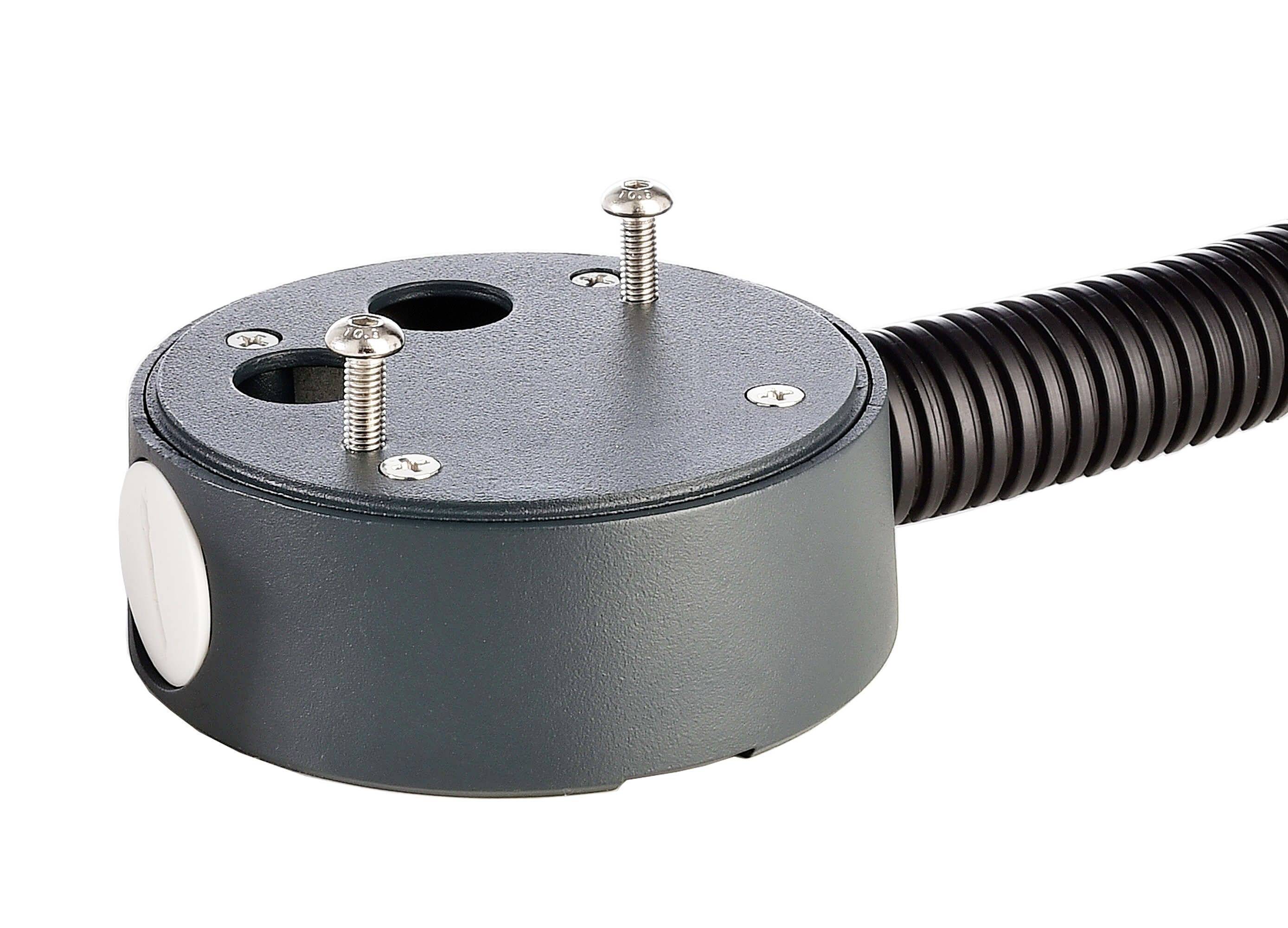 Okrągły uchwyt z dwoma otworami na śruby i elastycznym przewodem.