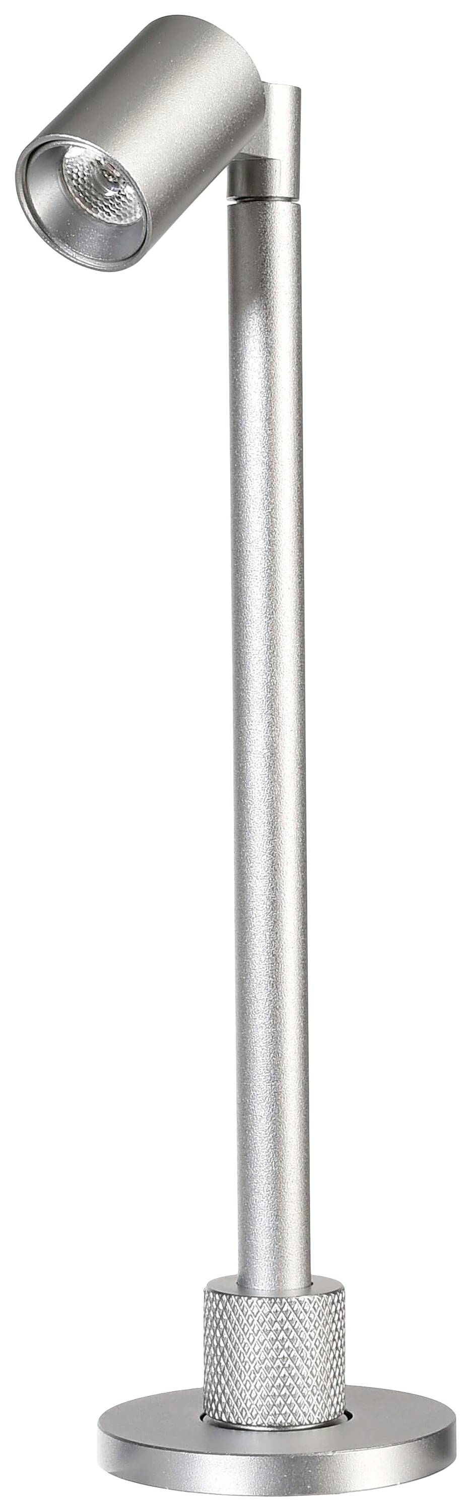 Srebrna lampa LED z obrotową głowicą na okrągłej podstawie. Idealna do akcentowego oświetlenia w nowoczesnym stylu.