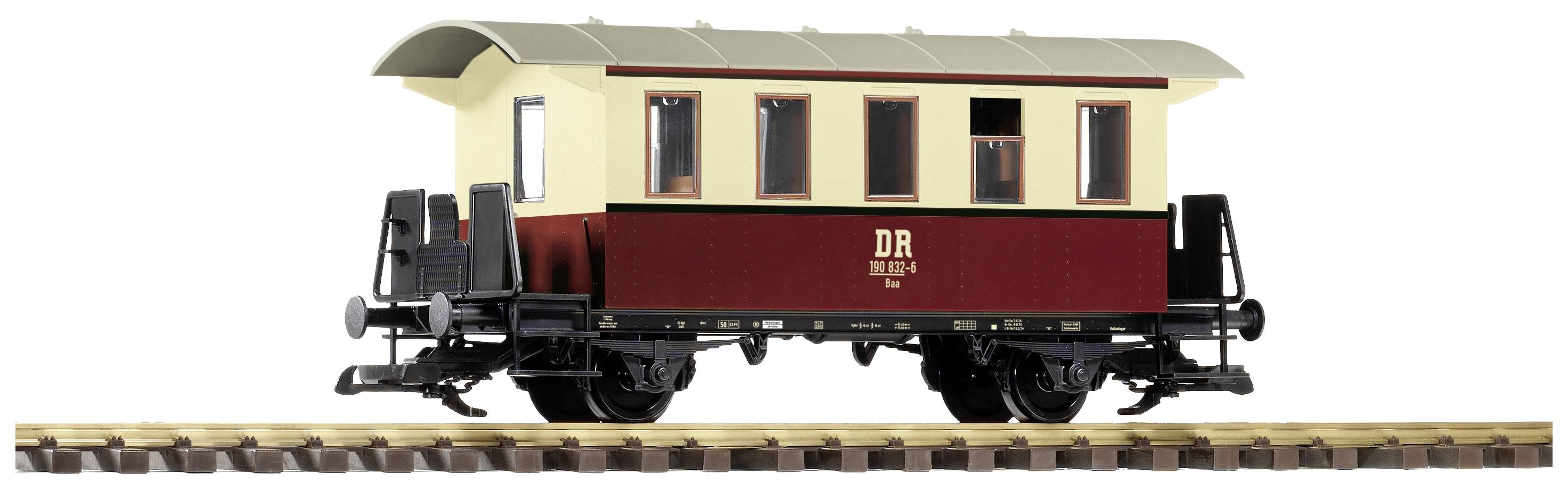 Model historycznego wagonu Deutsche Reichsbahn z czerwono-kremowym malowaniem na torach.