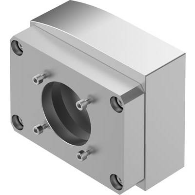 Prostokątny metalowy blok z okrągłym otworem pośrodku, otoczony czterema śrubami, prawdopodobnie element mechaniczny.
