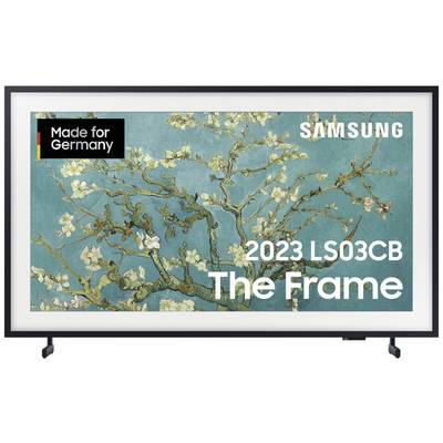 Telewizor Samsung 'The Frame' z obrazem kwitnących gałązek migdałowca. W lewym górnym rogu widnieje napis 'Made for Germany'.