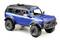 Niebieski model terenówki z dużym bagażnikiem dachowym i solidnymi oponami, idealny do przygód w terenie.