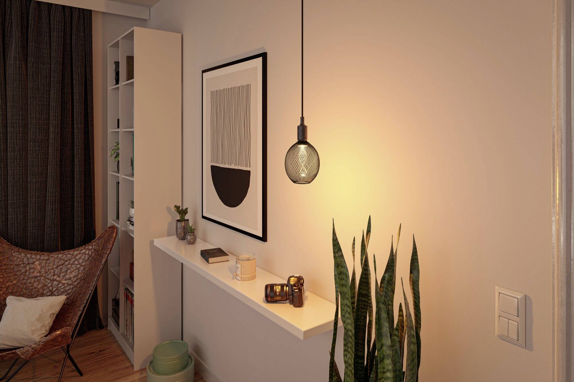 Przytulny salon z minimalistyczną dekoracją ścian, wiszącą żarówką i roślinami, które wprowadzają miękkie światło i spokój.