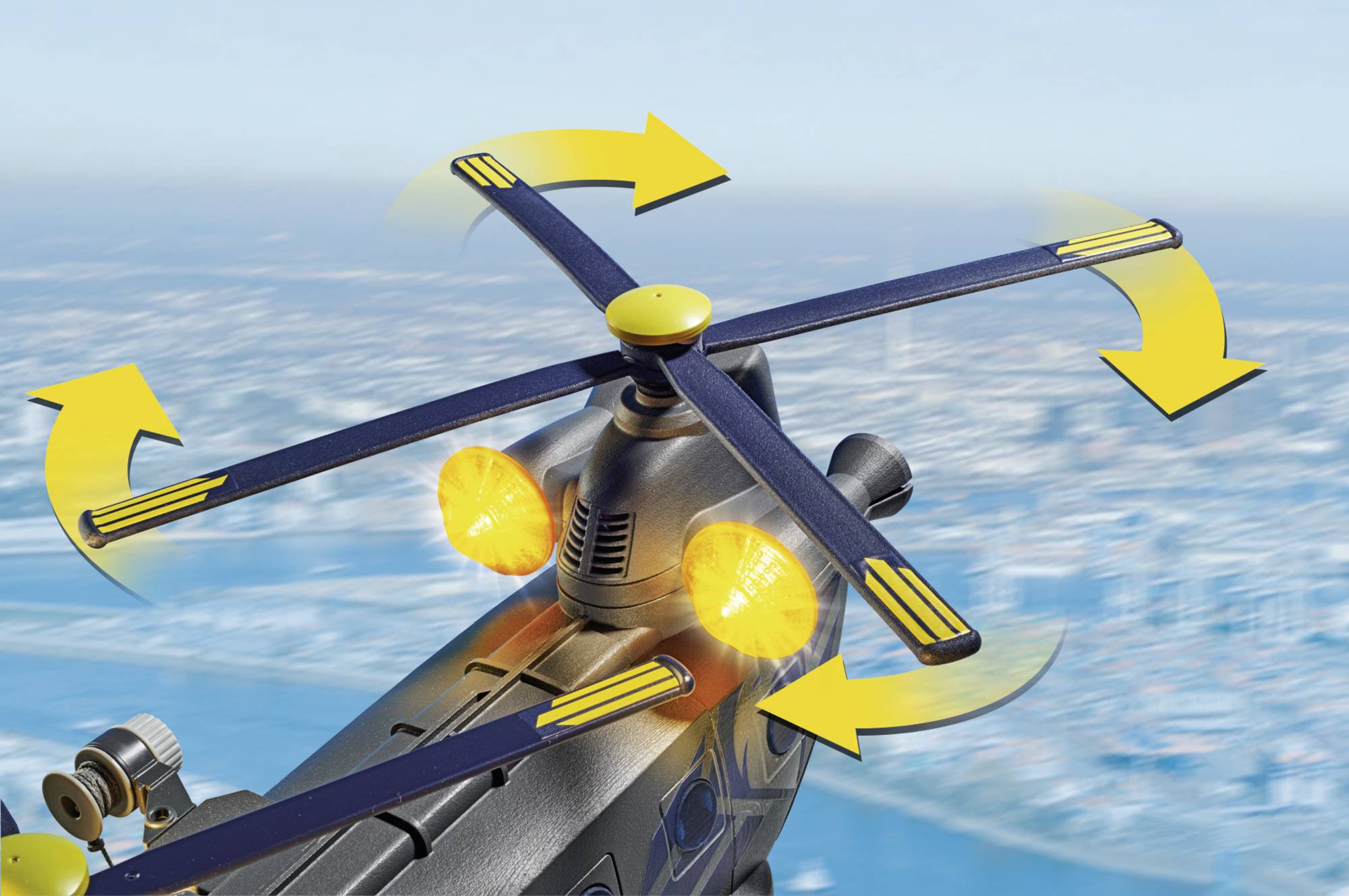 Obraz przedstawia łopaty wirnika modelu ze żółtymi strzałkami wskazującymi kierunek obrotu, na tle rozmytej panoramy miasta.