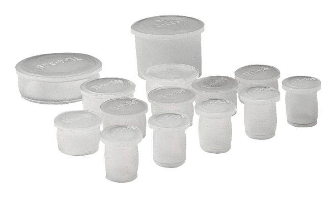 Różne białe, cylindryczne pojemniki silikonowe w różnych rozmiarach.