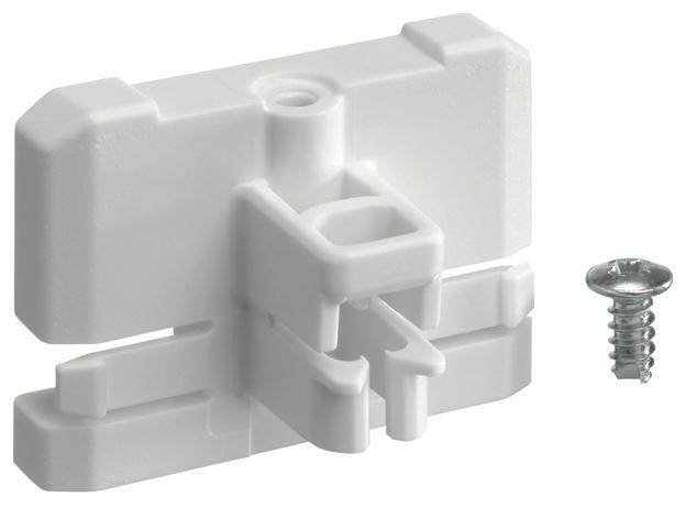 Biały plastikowy uchwyt obok śruby. Uchwyt posiada centralne zagłębienie służące do mocowania i pozycjonowania na powierzchniach.