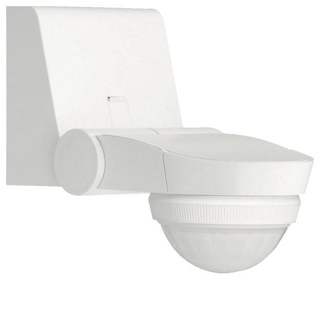 Biały czujnik ruchu zamontowany na ścianie, o okrągłej obudowie, przeznaczony do monitorowania ruchu w pomieszczeniach lub korytarzach.