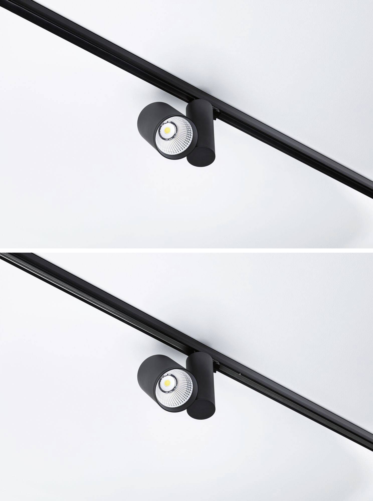 Czarna lampa szynowa z dwoma cylindrycznymi reflektorami, zamontowana na suficie.