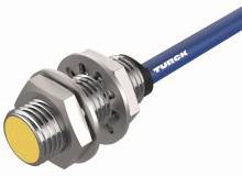 Czujnik metalowy z żółtą, okrągłą obudową i niebieskim przewodem. Odpowiedni do zastosowań przemysłowych do wykrywania metali.