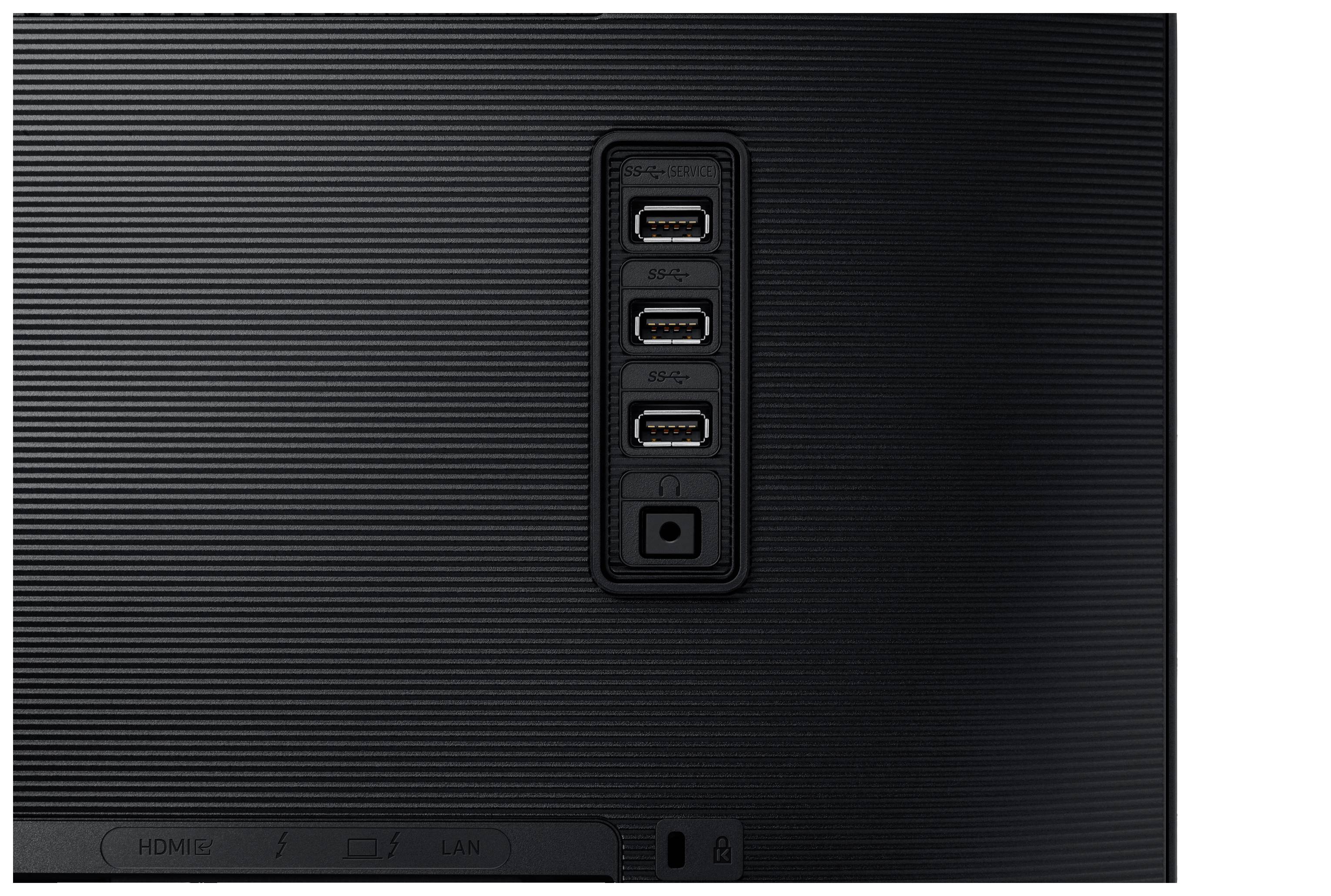 Tylna strona monitora z czterema portami USB i małym przyciskiem poniżej.