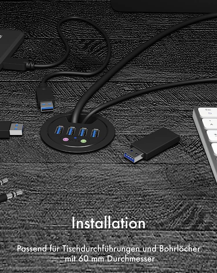 Okrągły hub USB z czterema portami jest wbudowany w biurko. Tekst poniżej głosi: 'Instalacja odpowiednia do przepustów i otworów w stole o średnicy 60 mm'.