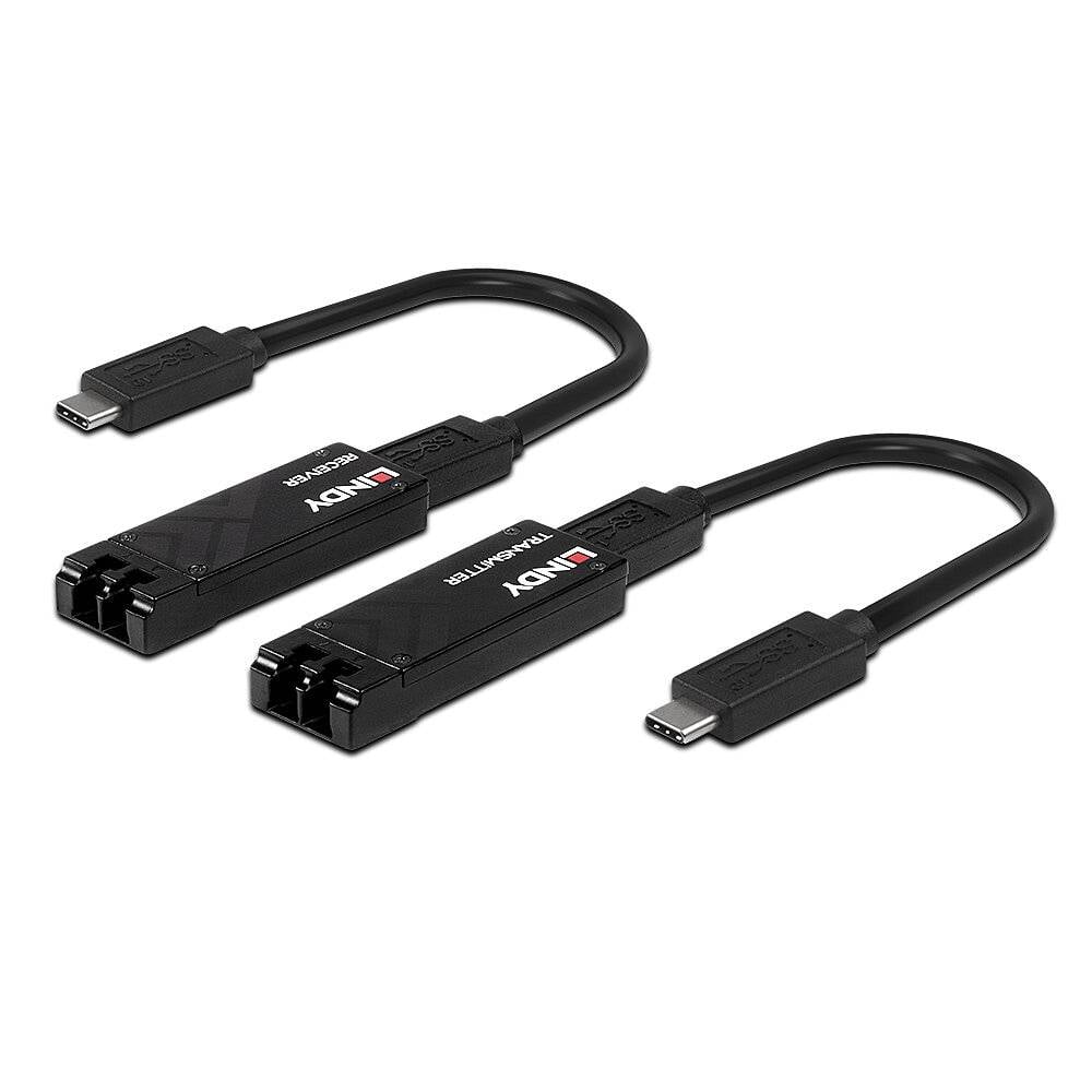 Dwa czarne adaptery z wtyczkami USB-C i po dwa złącza optyczne marki 'Lindy', widoczne na białym tle.