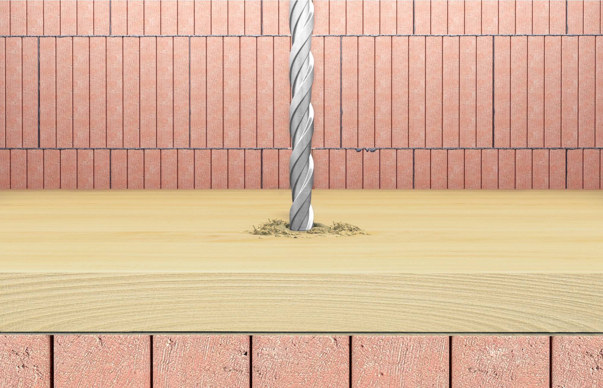 Wiertło przebija płytę drewnianą, za nią widoczne są czerwone cegły tworzące ścianę.